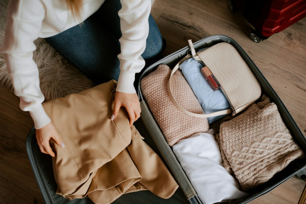 woman packing suitcase